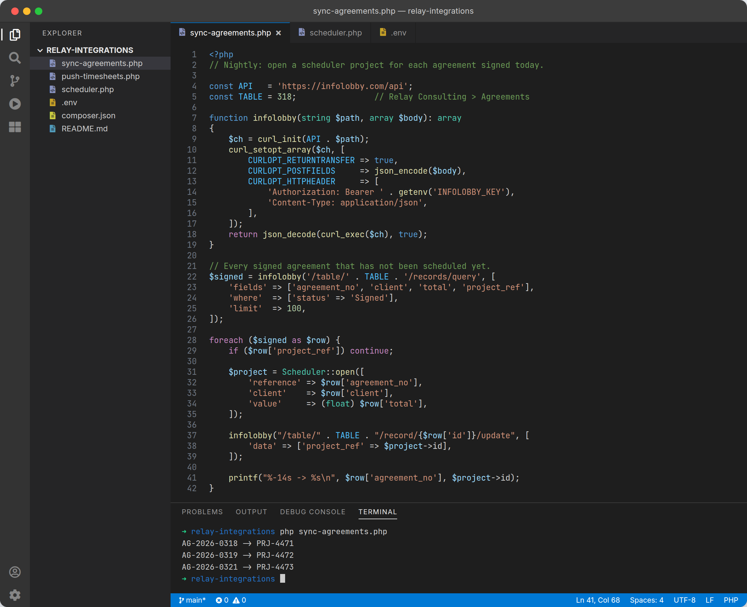 A PHP script in VS Code calling the InfoLobby API: a Bearer key from the environment, a records query, and a record update written back